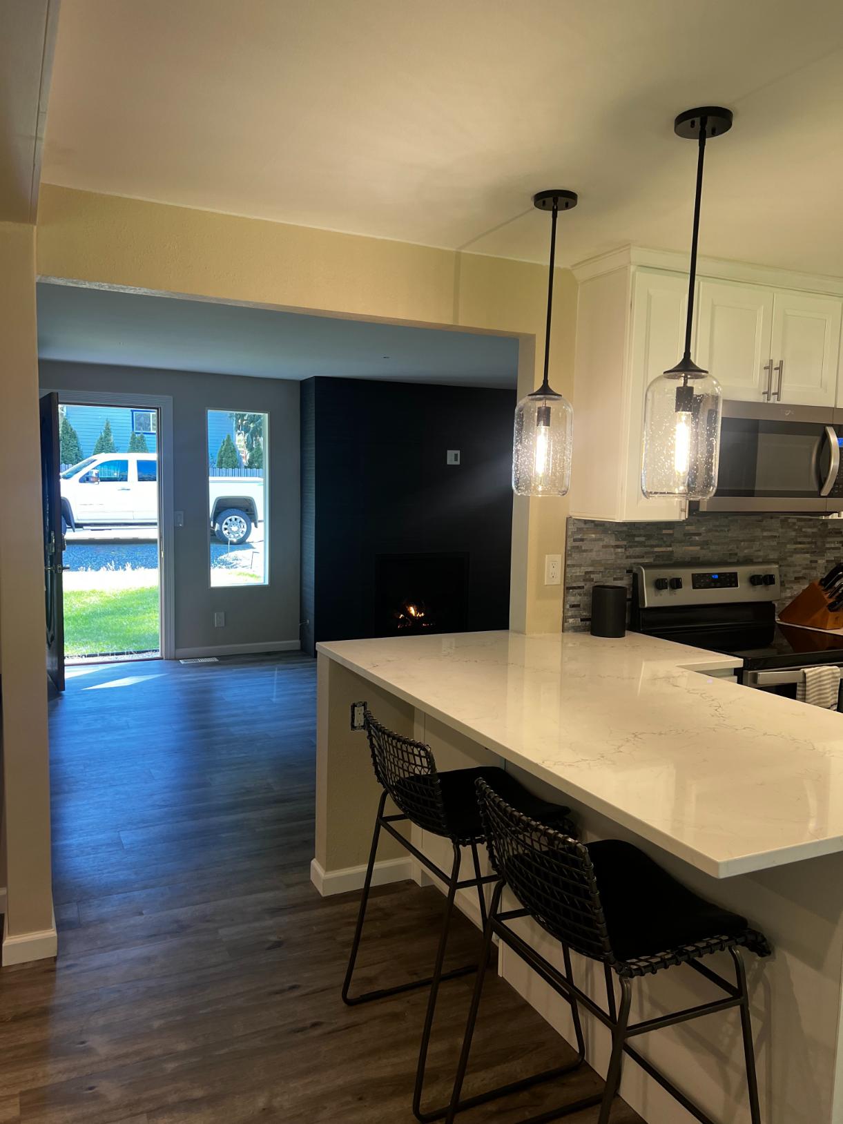 Kitchen island layout with pendant lighting and modern workflow design