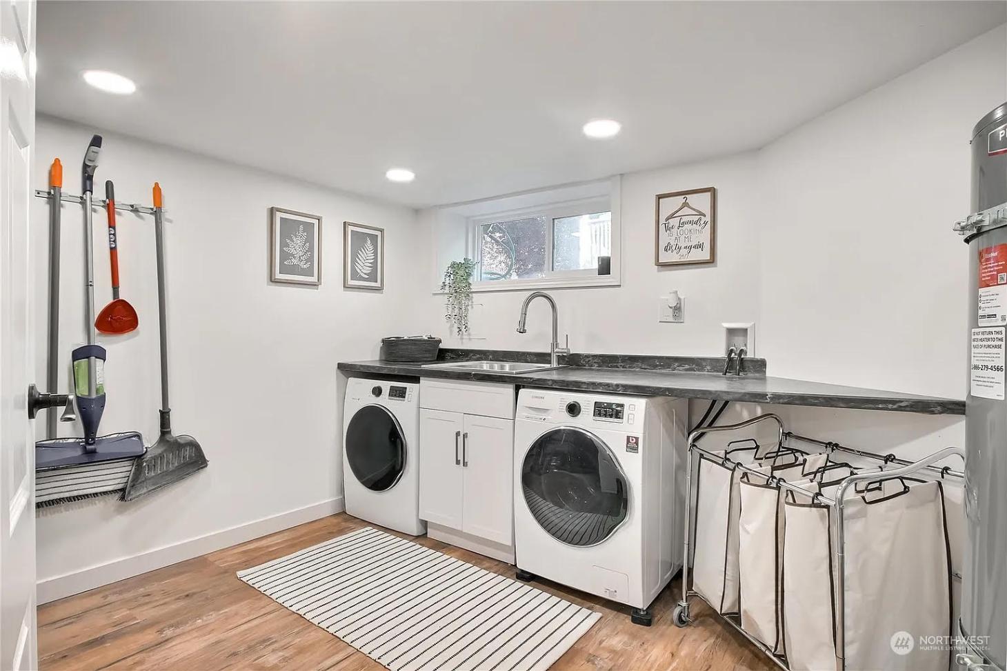 Mudroom laundry room with sink and washer for functional space